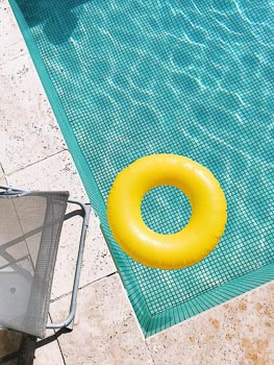 Yellow donut in pool